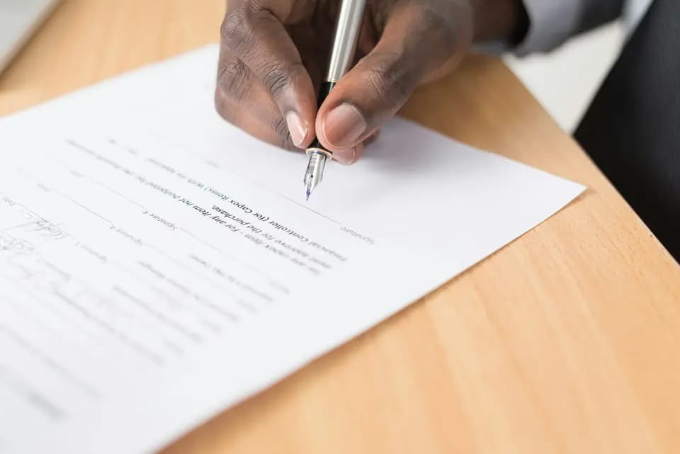 A printed form being completed by hand