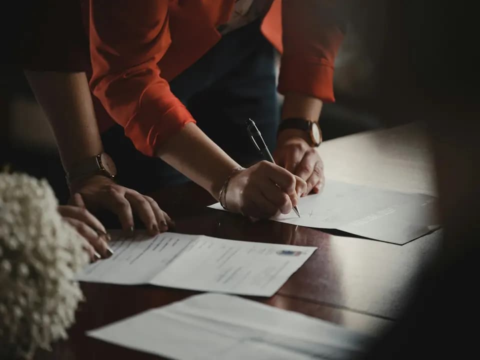 A document being marked up at a desk