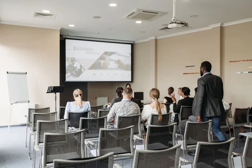 Attendees following a presentation in a conference room