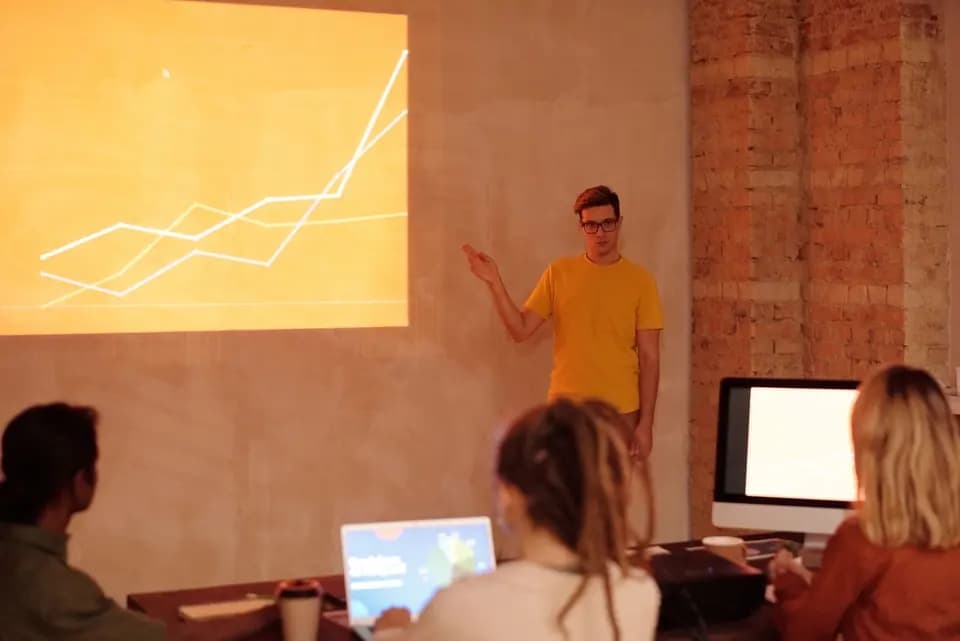 A colleague presenting analysis to a small group